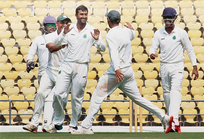 Assam bowler Amit Burman celebrating with teammates 