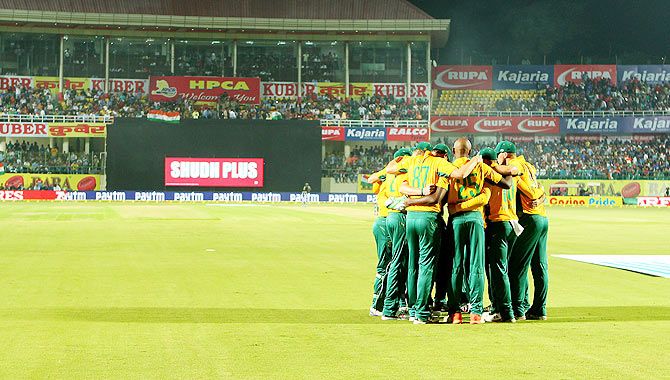 The South African cricketers form a huddle