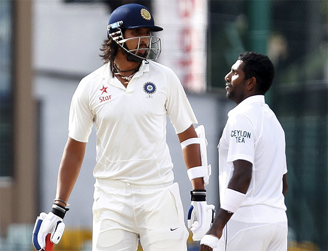 India's Ishant Sharma (left) argues with Sri Lanka's Dhammika Prasad 