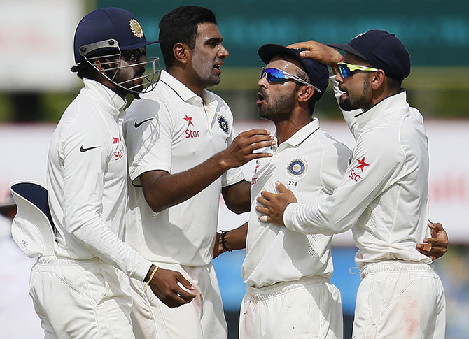 India's Ravichandran Ashwin (second left) celebrates with his teammates 