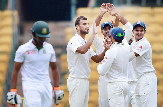India 'A' bowler Ishwar Pandey celebrates with teammates after dismissing Anamul Haque of Bangladesh 'A' at Chinnaswamy Stadium in Bengaluru