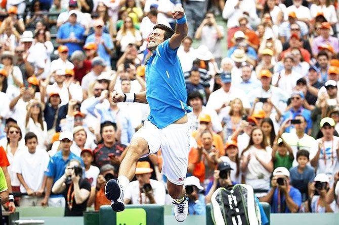 Novak Djokovic celebrates after defeating Kei Nishikori in the Miami Open final in Key Biscayne, Florida on Sunday, April 3