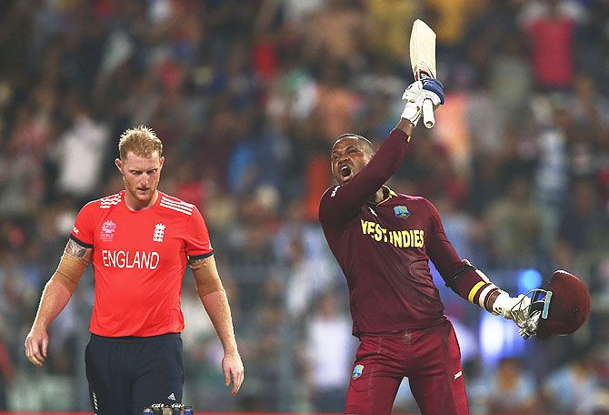 West Indies' Marlon Samuels celebrates after Carlos Brathwaite hit the second six of the last over as England's Ben Stokes looks on during their ICC World Twenty20 Final at Eden Gardens in Kolkata on Sunday