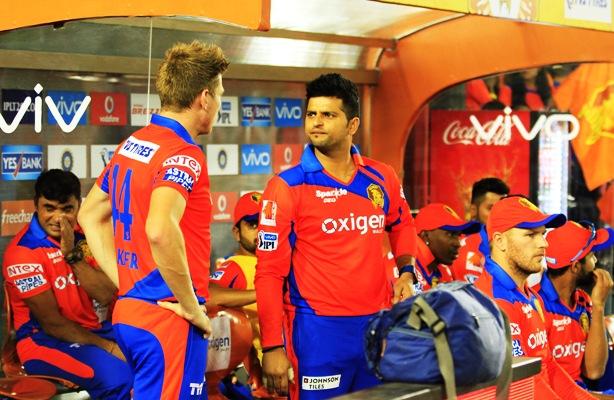 Gujarat Lions captain Suresh Raina in coversation with teammate James Faulkner