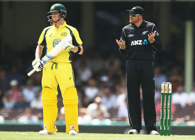 Australia captain Steven Smith watches on as New Zealand's Martin Guptill questions the bolwer for a review during the first One Day International at Sydney Cricket Ground on Sunday