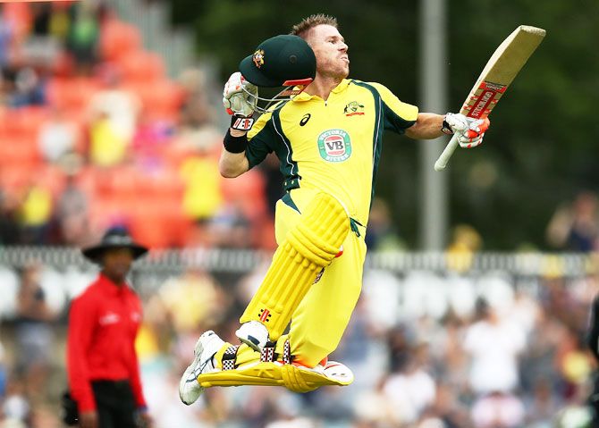 Australia's David Warner does his signature celebration as he completes his ton against New Zealand in the 2nd ODI at Manuka Oval in Canberra, Australia, on Tuesday