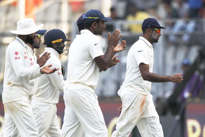 R Ashwin leads the team out after picking five wickets on Day 2 of the 4th Test in Mumbai on Friday 