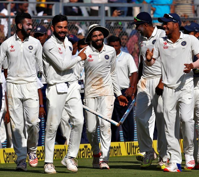  The Indian players celebrate winning the fourth Test in Mumbai on Monday
