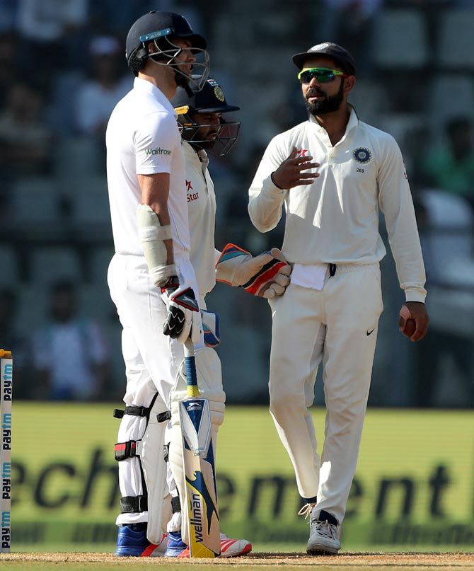 Virat Kohli and James Anderson exchange some words on Day 5 of the fourth Test in Mumbai on Monday