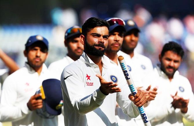 India captain Virat Kohli takes a lap of honour with team mates after winning the match