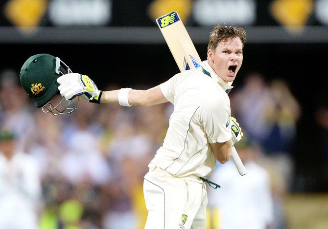 Australia captain Steve Smith celebrates scoring a century against Pakistan on Day 1 of the first Test match at The Gabba in Brisbane on Thursday