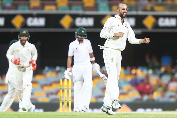 Australia's Nathan Lyon celebrates dismissing Pakistan's Babar Azam on Day 3 of the first Test match at The Gabba in Brisbane on Saturday