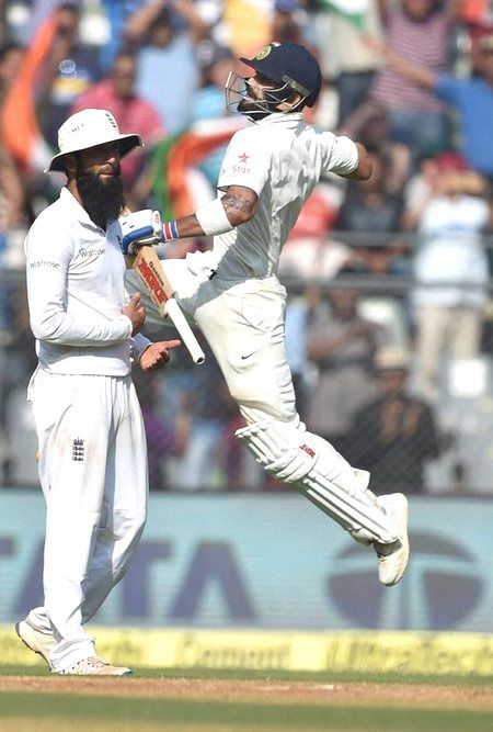 A pumped Virat Kohli celebrates on completing his century against England on Day 3 of the 4th Test in Mumbai on Saturday