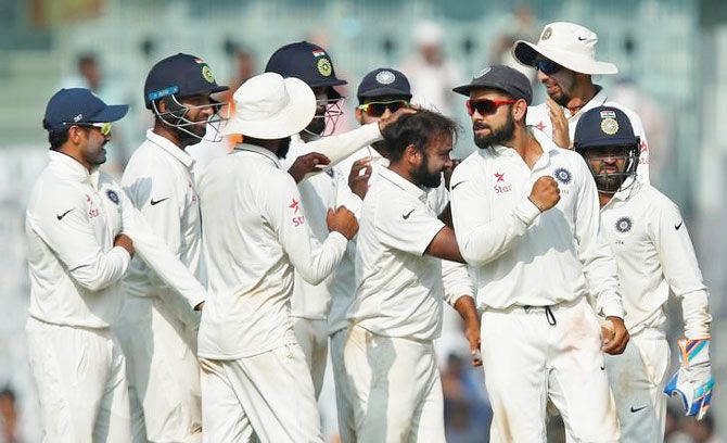 India players celebrate the wicket of Liam Dawson on Tuesday