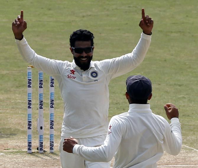 Ravindra Jadeja celebrates the wicket of Alastair Cook