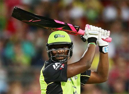 The Sydney Thunders' Andre Russell bats with the controversial black bat during a BBL match