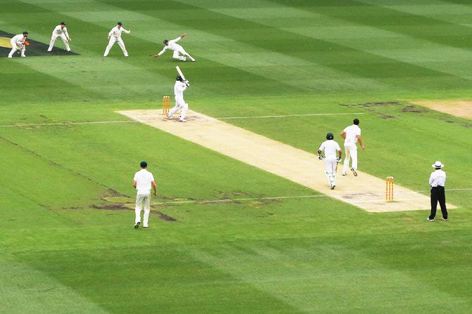 Australia's Usman Khawaja drops a catch after the ball was edged by Pakistan's Mohammad Amir