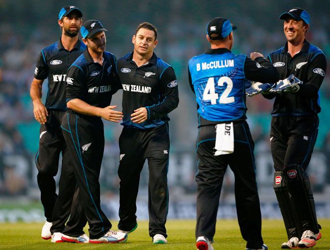 New Zealand's Nathan McCullum celebrates a wicket with teammates