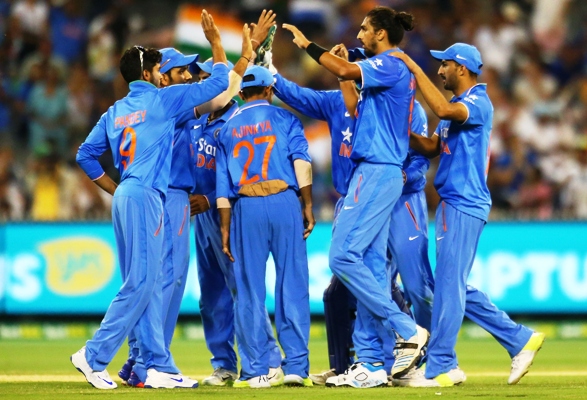 Indian players celebrate the fall of an Australian wicket 