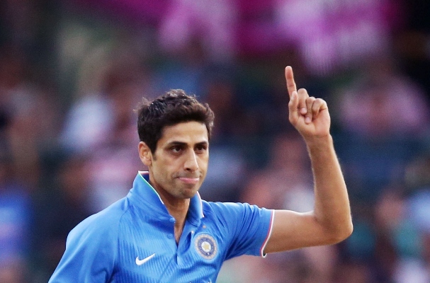India's Ashish Nehra celebrates taking the wicket of Usman Khawaja of Australia 