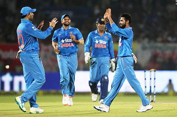 Ravindra Jadeja and Yuvraj Singh celebrate a wicket