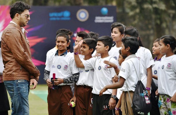 Yuvraj Singh interacts with the children 