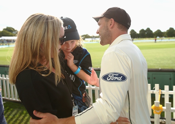 Brendon McCullum of New Zealand is congratulated by his wife Ellissa and daughter Maya 