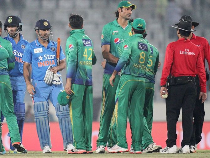 Pakistan players shake hands with Indian players after the Asia Cup match