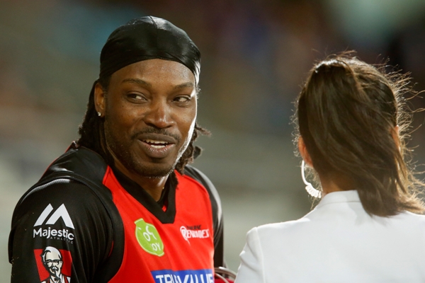 Chris Gayle of the Melbourne Renegades gives a TV interview to Mel Mclaughlin 
