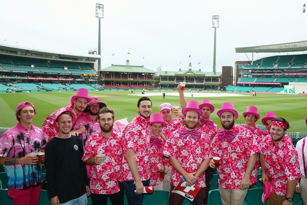 Members of the crowd dressed in pink for Jane McGrath Day pose 