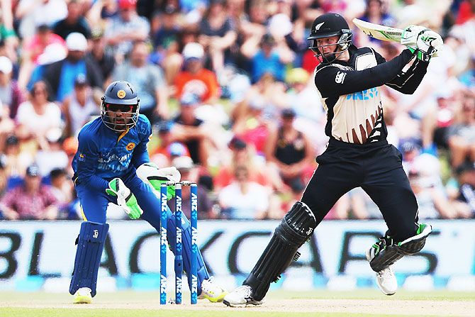 Martin Guptill of the Black Caps plays the ball away for four runs