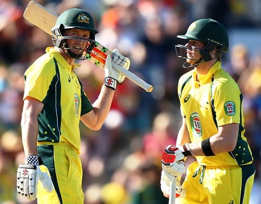 George Bailey of Australia celebrates his half century with Steven Smith during the the first ODI against India in Perth