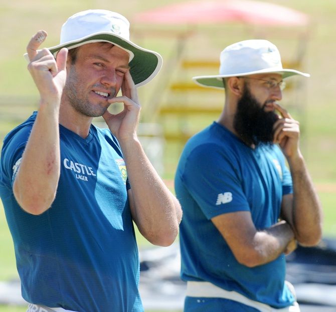 AB de Villiers and Hashim Amla look on during the South African training session
