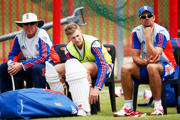 Coach Trevor Bayliss of England with Joe Root and captain Alastair Cook during a practice session 