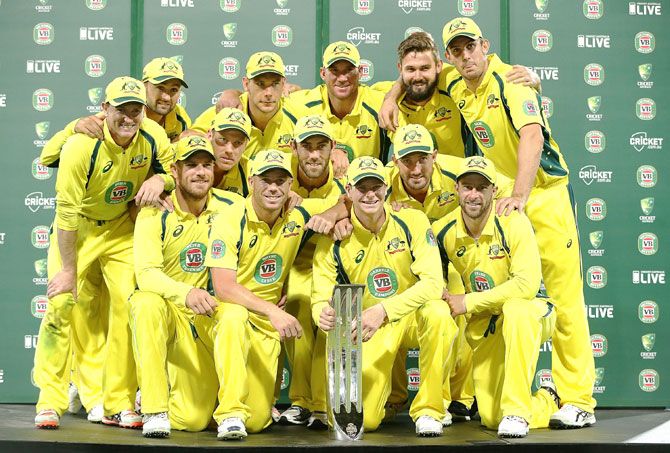The Australian team pose with the winners' trophy after winning the five-match Commonwealth Bank One Day Series 4-1 at Sydney Cricket Ground on Saturday