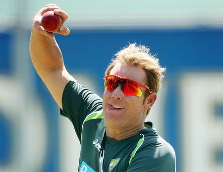 Former Australia spinner Shane Warne bowls during a nets session