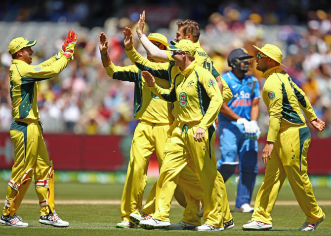 Australian players celebrate the fall of an Indian wicket during the recent ODI series 