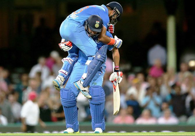 India's Suresh Raina and Yuvraj Singh are ecstatic after their win in the third T20 in Sydney on Sunday