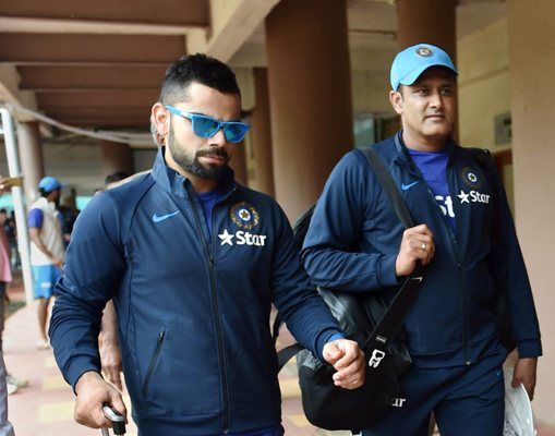 Indian Test Captain Virat Kohli and Coach Anil Kumble arrive for a training session