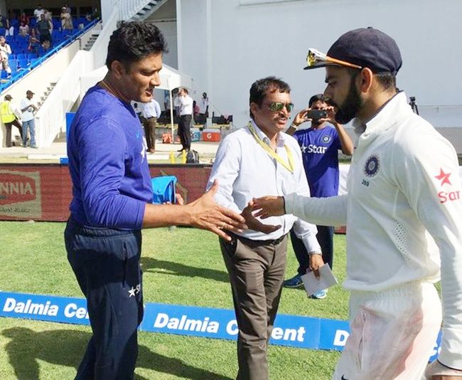 India’s coach Anil Kumble congratulates captain Virat Kohli after beating West Indies in the first Test in Antigua last Sunday