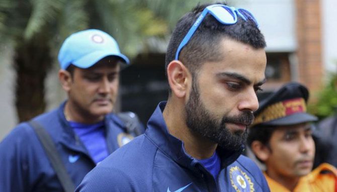  India’s captain Virat Kohli and then head coach Anil Kumble in the background