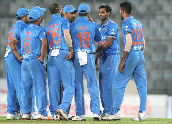 Indian players celebrate the wicket of United Arab Emirates' opener Swapnil Patil 