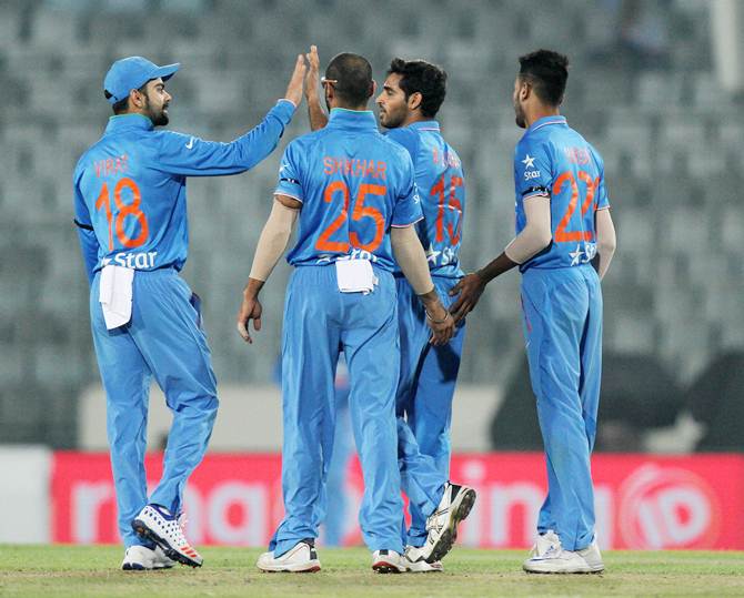 India's players celebrate the dismissal of Swapnil Patil in the Asia Cup match against the UAE