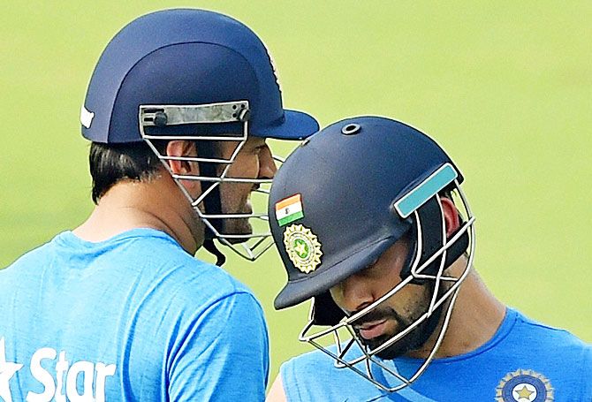 India's captain Mahendra Singh Dhoni (left) and teammate Virat Kohli at the practice session at the Eden Gardens in Kolkata on Wednesday
