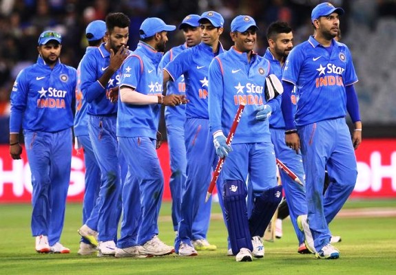 Captain MS Dhoni leads the Indian players off the field 