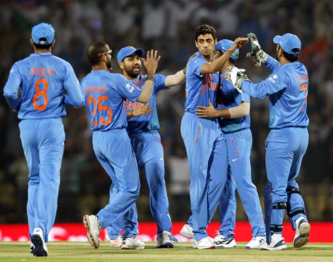 India's Ashish Nehra is congratulated by his teammates 