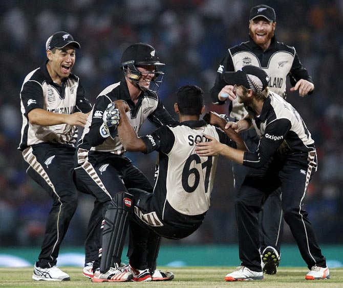 New Zealand's Ish Sodhi is congratulated by his teammates 