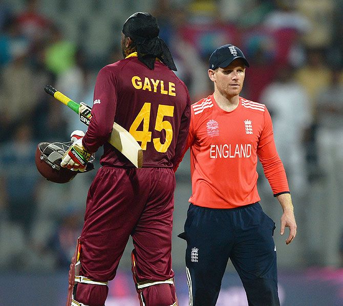 West Indies' Chris Gayle is congratulated by England captain Eoin Morgan