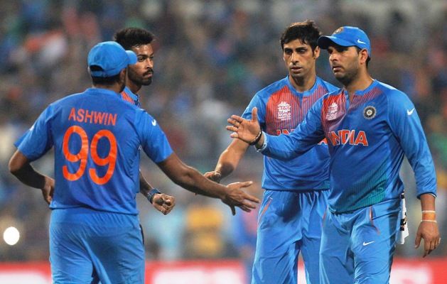 India's Ravichandran Ashwin, Hardik Pandya, Ashish Nehra and Yuvraj Singh celebrate the dismissal of Pakistan's Shoaib Malik during the ICC World T20 match against Pakistan at Eden Gardens