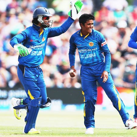 Sri Lanka's Jeffrey Vandersay (left) celebrates with Dinesh Chandimal after a dismissal